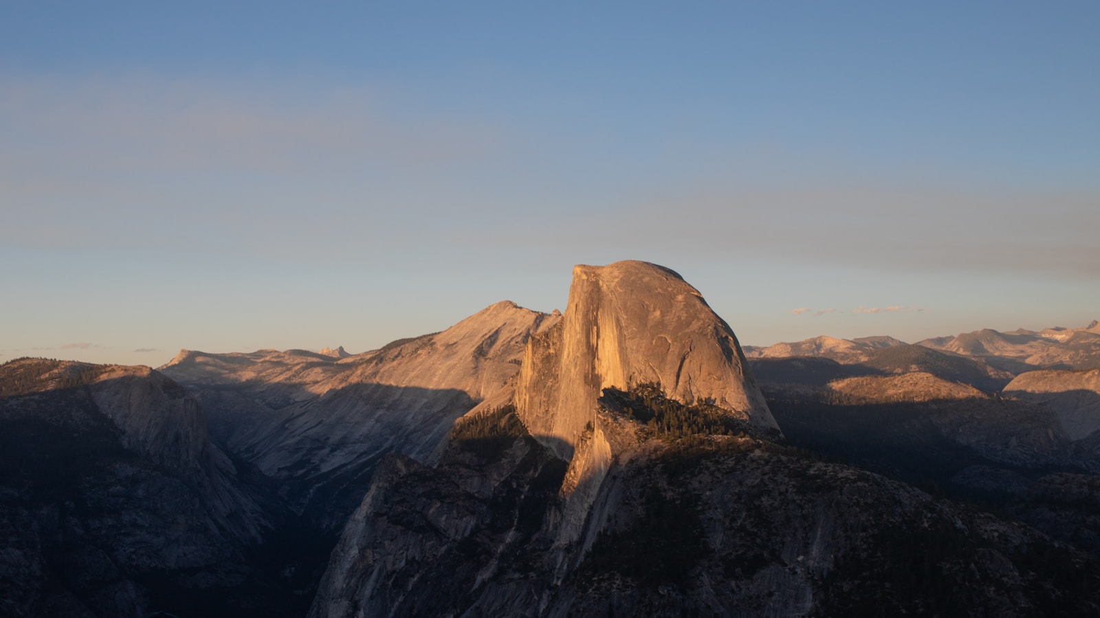 A view of the top of a mountain with a sky background