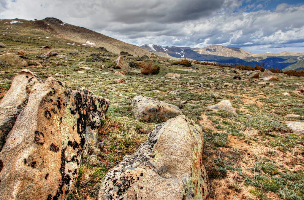 a large rock in the middle of a field