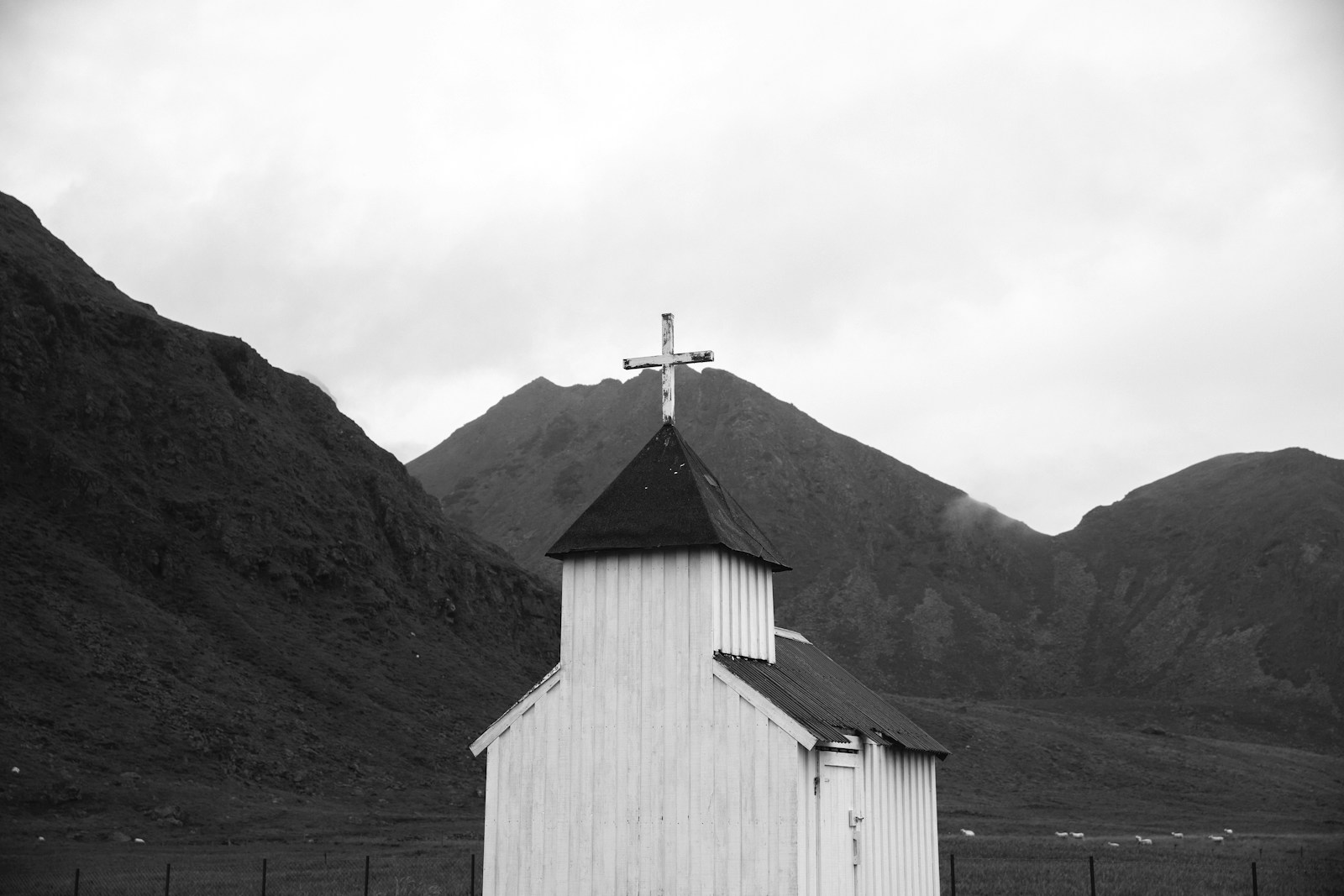 Landscape photography of white and black wooden church