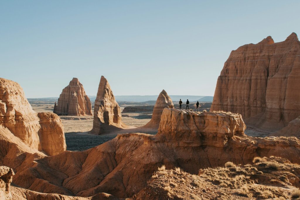 a group of people standing on top of a mountain