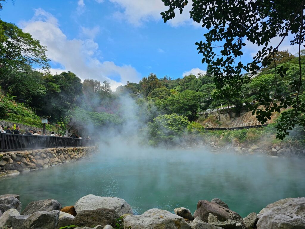 a body of water surrounded by rocks and trees