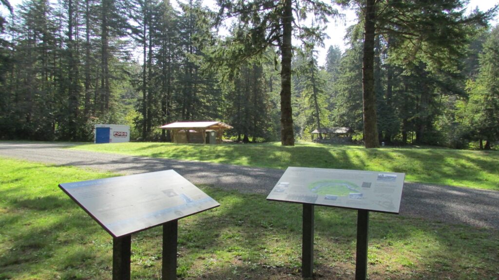 Two informational signs displayed in a park, providing details about the surrounding environment and its features.