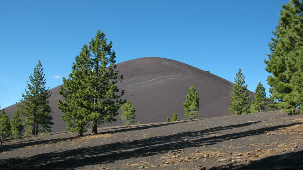 Scenic mountain vista in Lassen Volcanic National Park, showcasing natural beauty with its towering peaks and rich vegetation.