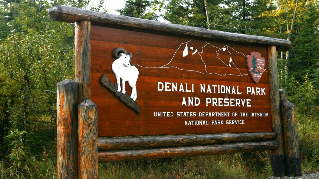 "Denali National Park and Preserve" sign set in a picturesque landscape, highlighting the park's breathtaking wilderness.