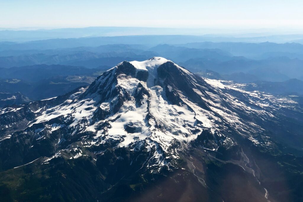 Black and white mountain under blue sky during daytime