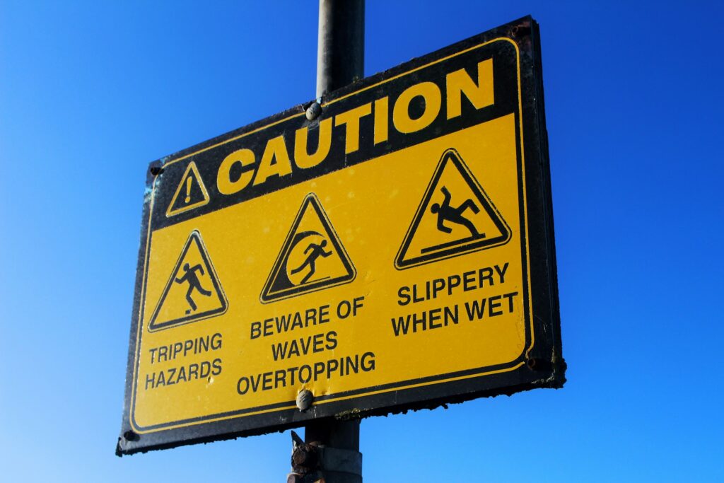 Caution sign in yellow is designed to draw attention and convey important safety information.