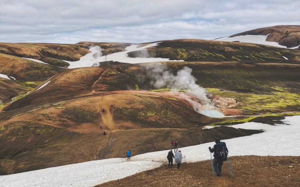 a group of people hiking on a mountain