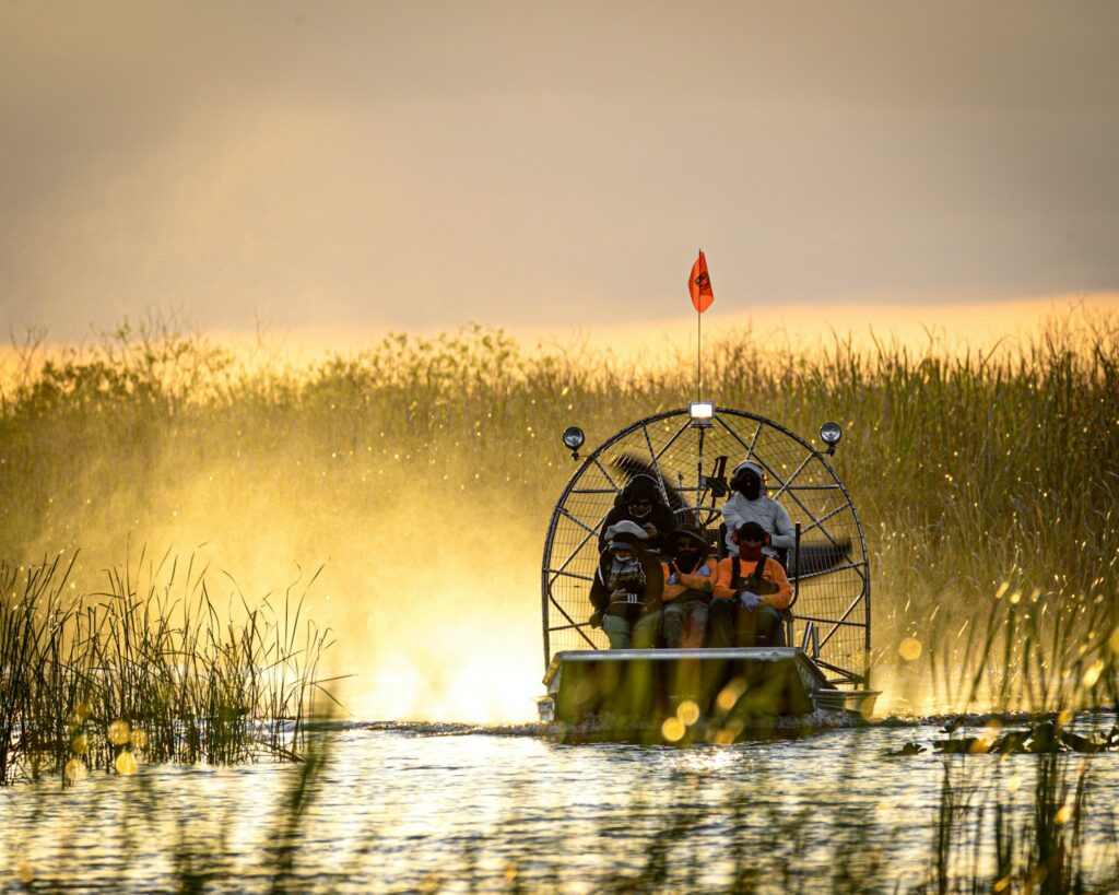 A couple of people on a boat in a body of water
