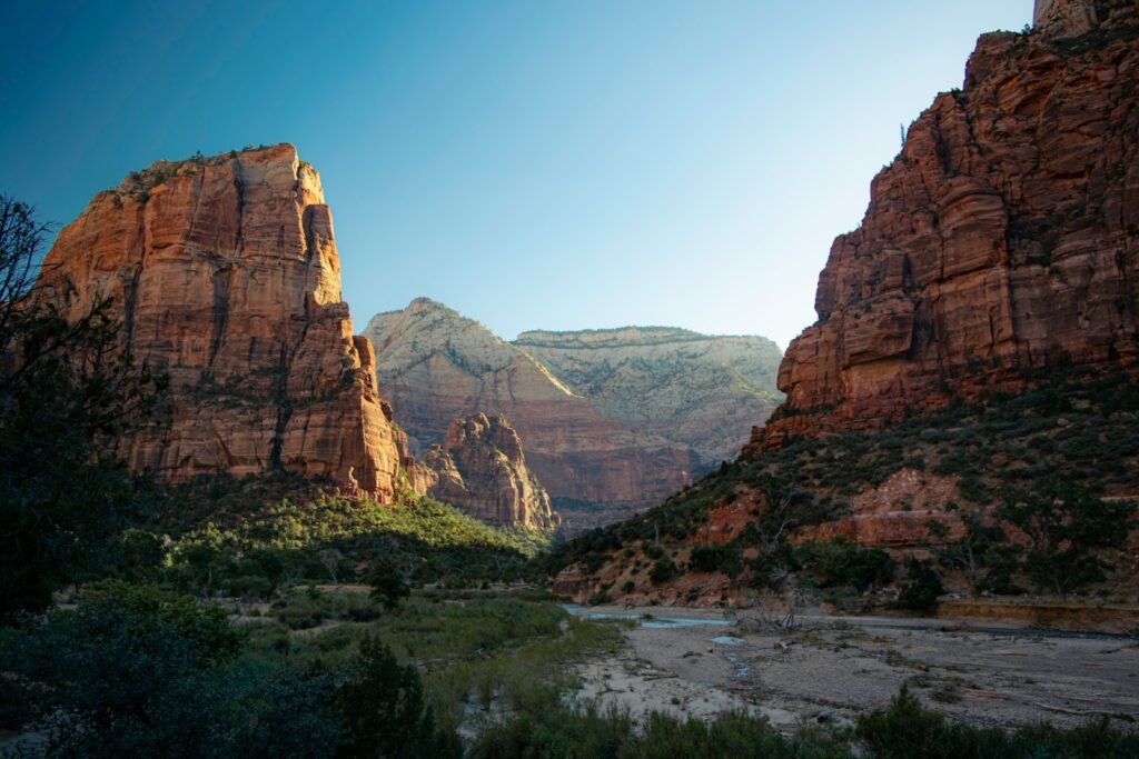 a view of a canyon with mountains in the background