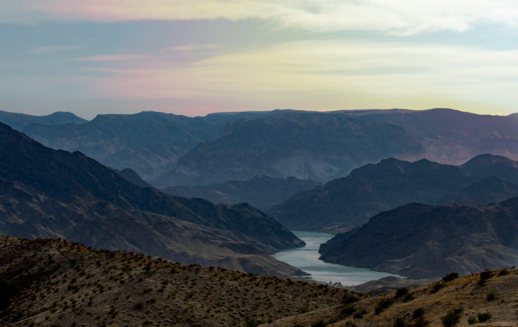 Lake in the middle of mountains during daytime