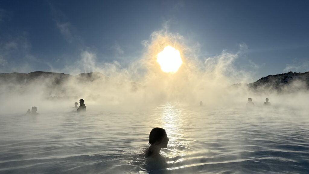 A group of people swimming in a large body of water