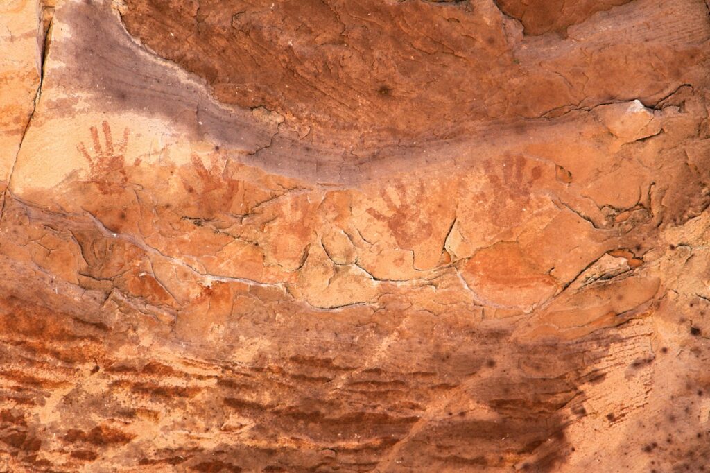 A close up of a rock with a bird on it