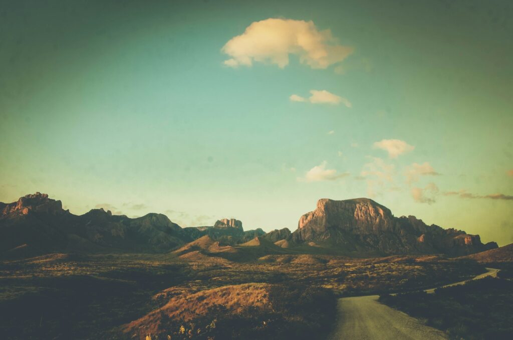 brown rocky mountain under blue sky