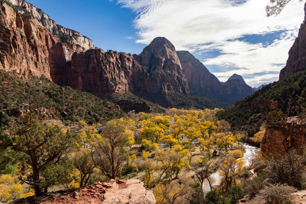 a scenic view of a river surrounded by mountains