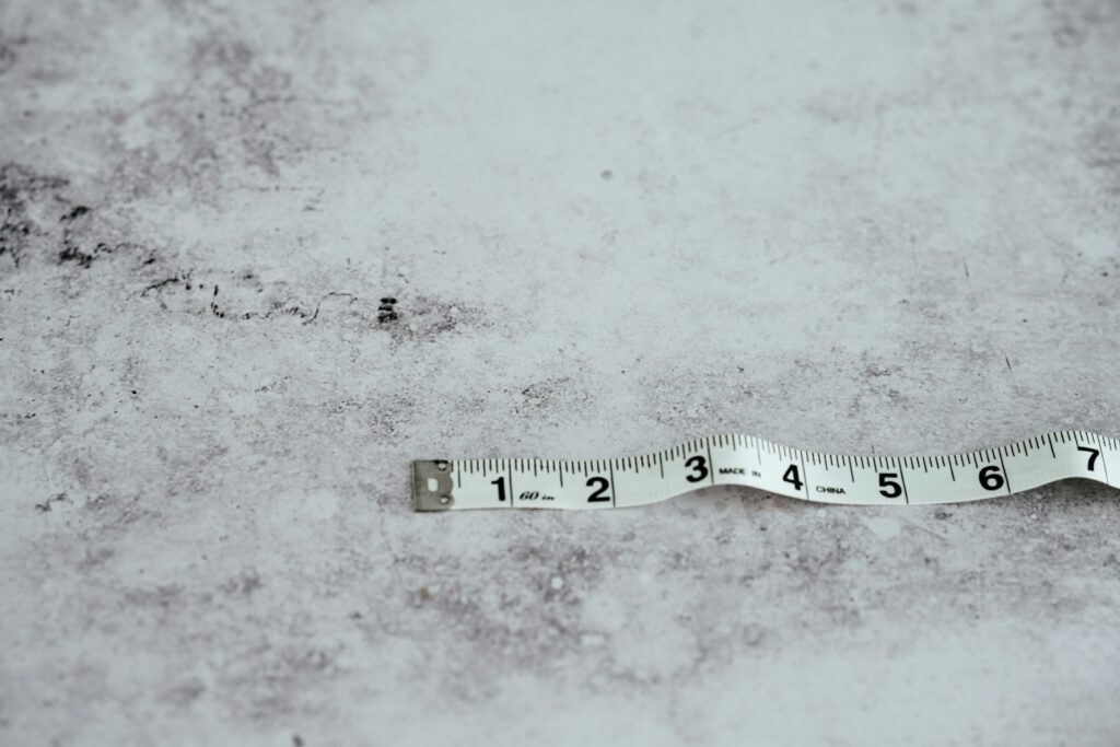 white measuring tape on white surface