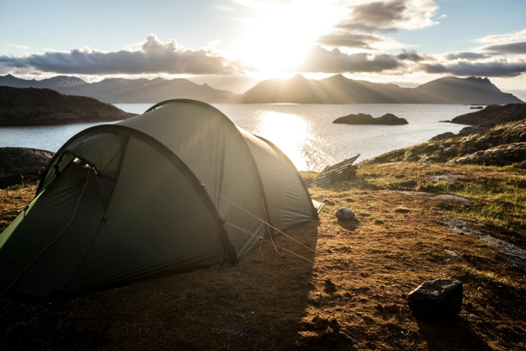 Gray tent on top of mountain