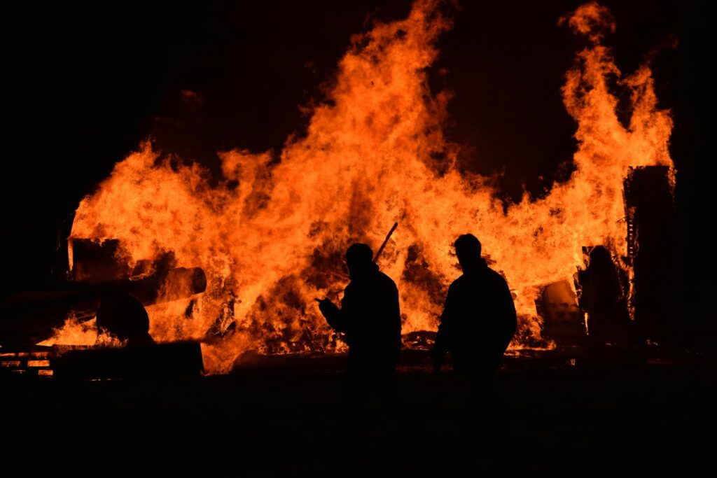 People walking near fire