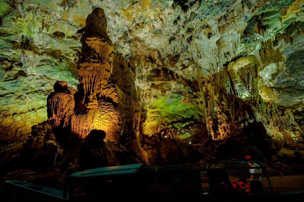 A group of people standing in a cave
