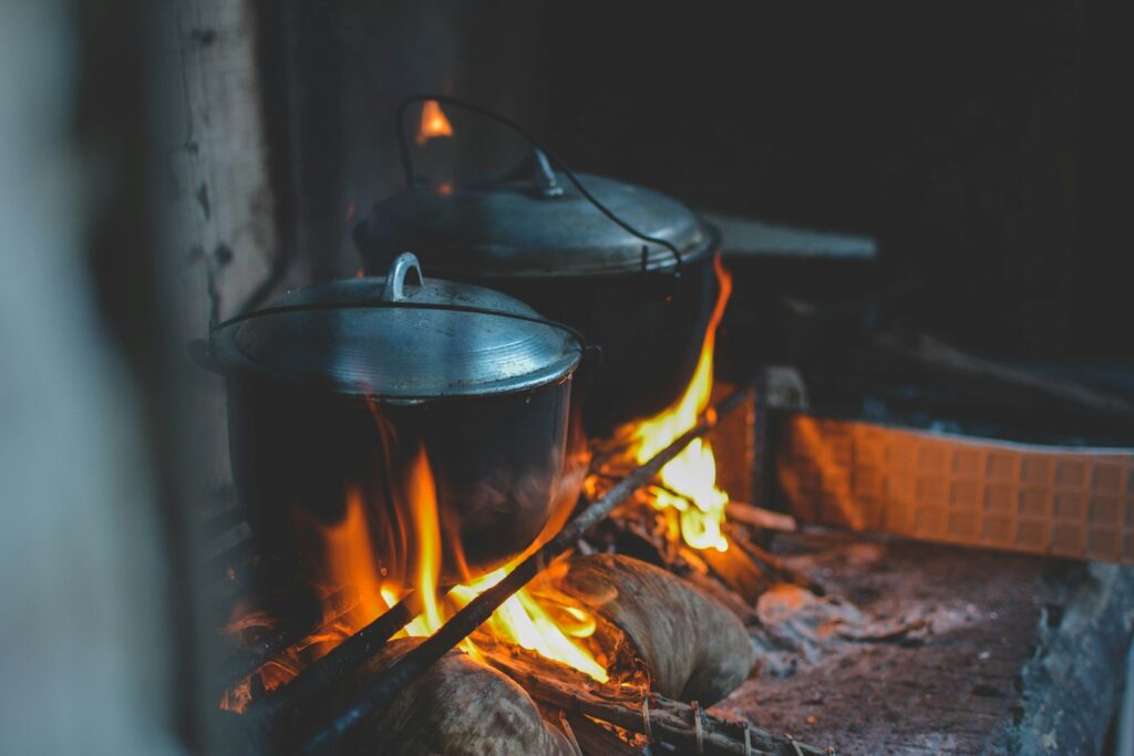 Two black cassesoles for cooking.