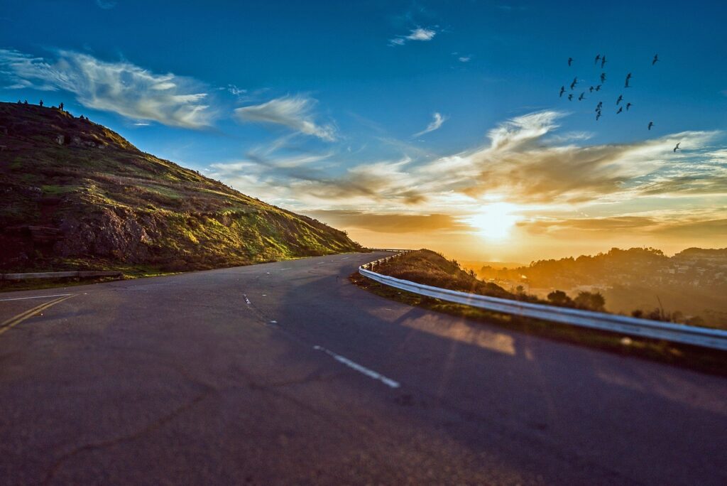 winding road, sunset, mountains, mountain landscape, street, avenue, pavement, asphalt, lane, sun, sky, road, travel, sunrise, landscape, nature, curve, trip, roadside, scenic, winding, rural, way, street, road, road, road, road, road, travel, sunrise
