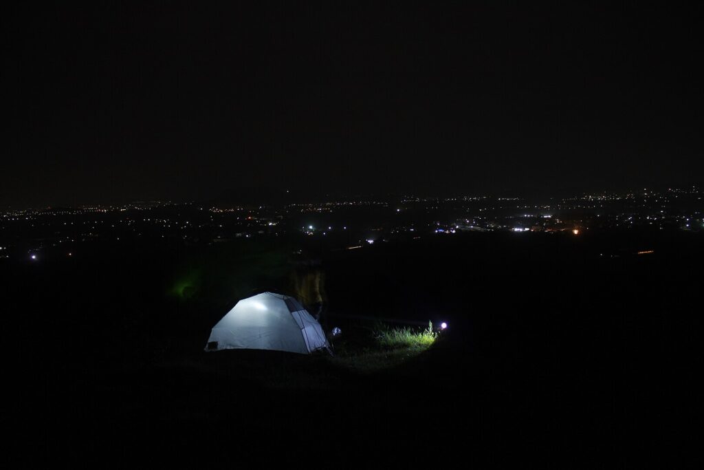 Solo camping into the wild with pet dog under the sky