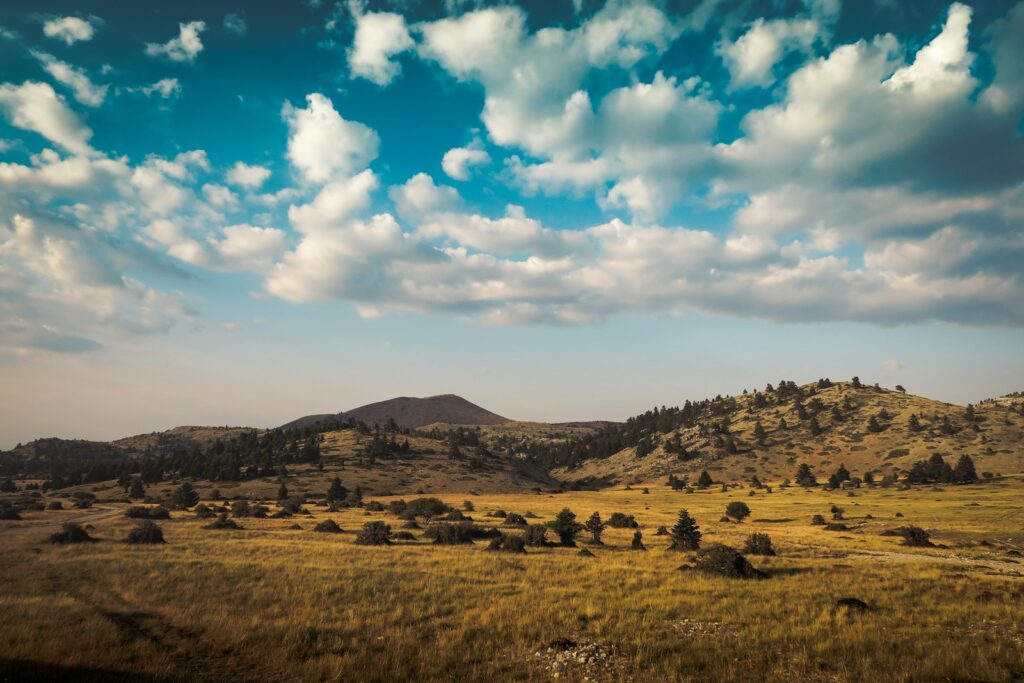 mountain under cloudy sky during daytime