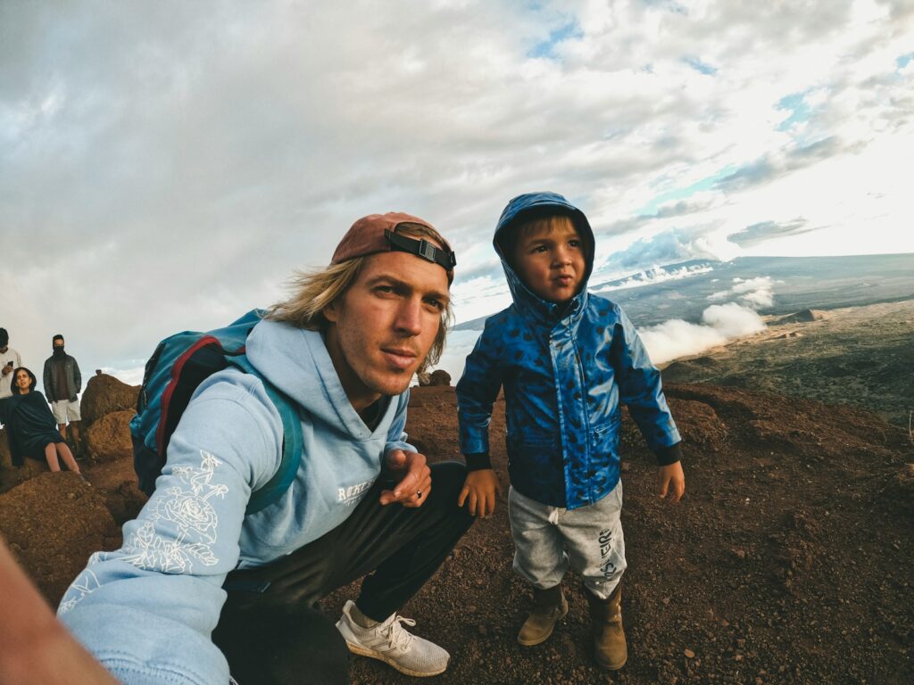 Man in gray jacket beside woman in gray jacket.