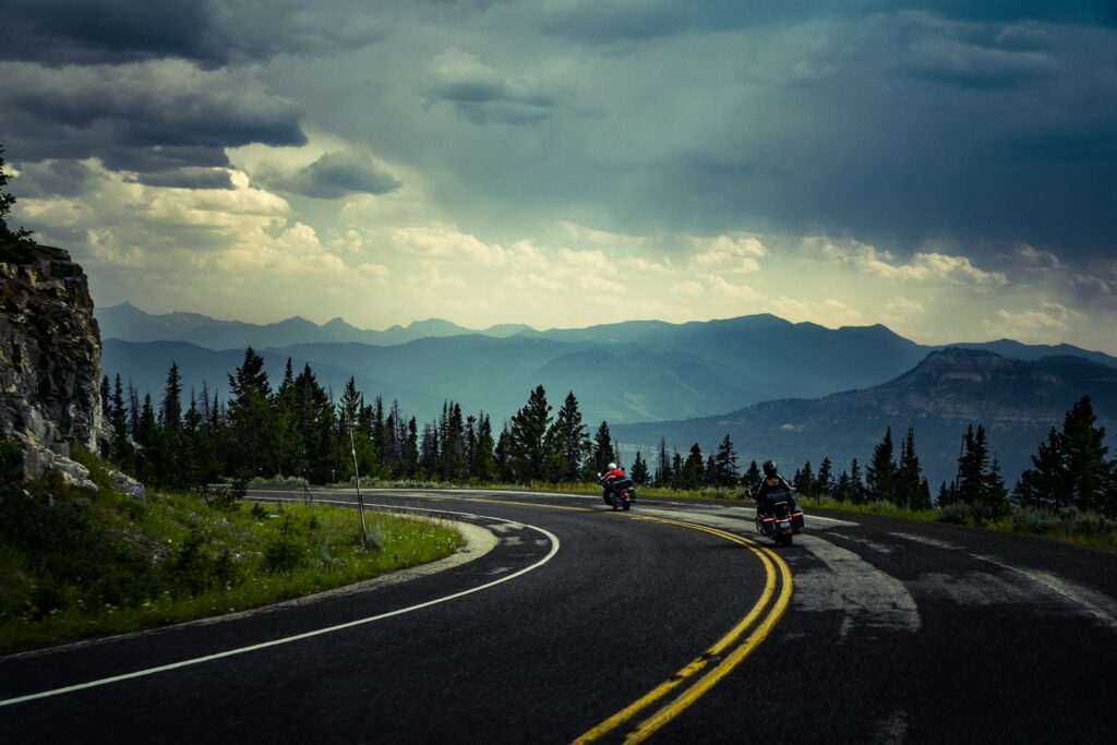 two motorcycles on road during daytime