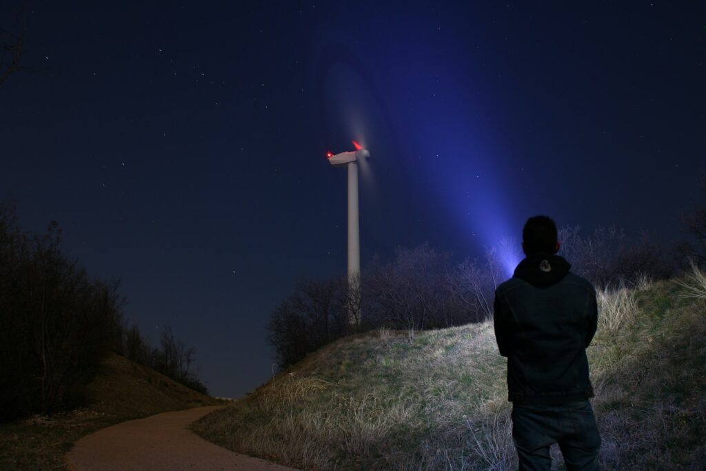 silhouette photography of person standing at night