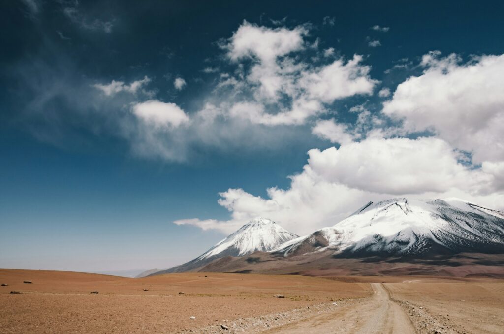 Valley near snowy mountain.